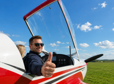 Man pilot in cockpit taking flying lesson anniversary gift for him